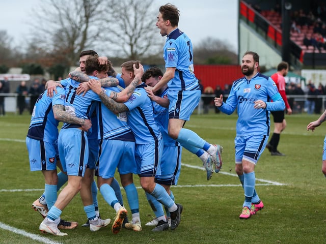 Harrison Brook is mobbed after putting Portchester 2-1 ahead. Picture by Nathan Lipsham