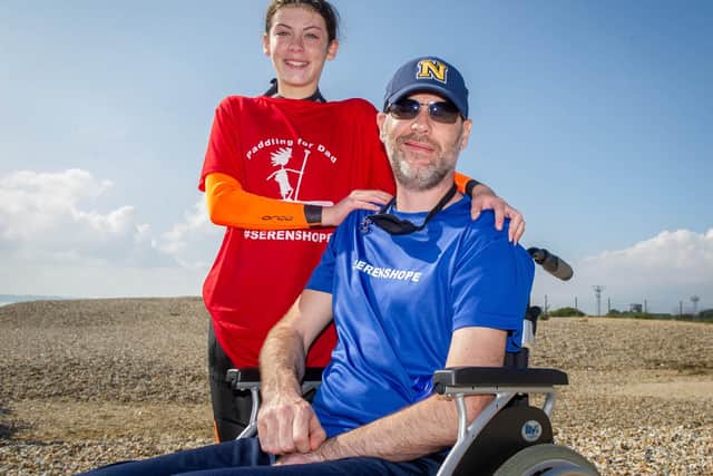 12-year-old Seren Killpartrick from Fareham is paddleboarding from the Isle of Wight to Stokes Bay to raise money for brain tumour treatment for her dad.Pictured: Seren Killpartrick with her day Paul at Stokes Bay beach on Thursday 16th September 2021Picture: Habibur Rahman