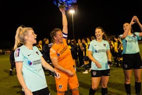 Portsmouth captain Hannah Haughton lifts the Portsmouth & District FA Senior Women's Cup. Picture by Alex Shute