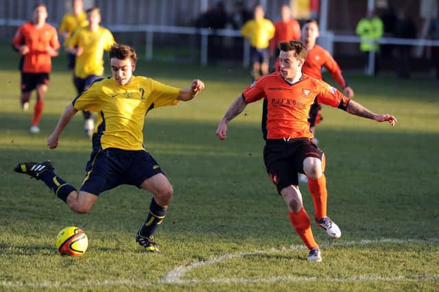 Rob Evans, left, in action for Moneyfields against Portchester in a Wessex League game in November 2013. Picture: Allan Hutchings