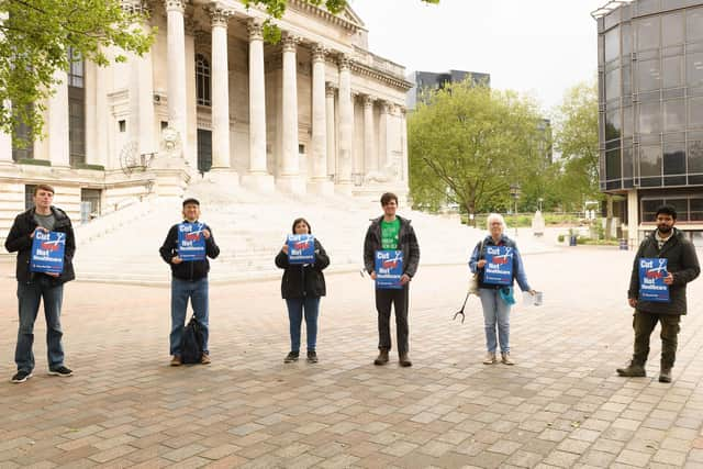 Protesters with their message: Cut war, Not healthcare. Picture: Keith Woodland (230521-8)