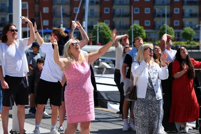 Supporters on the ground. Jack Farrugia abseils down the Spinnaker Tower, Portsmouth, in aid of his friend Josh Henwood-Evans. Picture: Chris Moorhouse (jpns 140522-33)