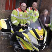 Chair Robert Smith on the bike. Next to him is Steve Luckett (Dave Luckett's son), Dave Luckett, and Tim Bennett, trustee and treasurer.