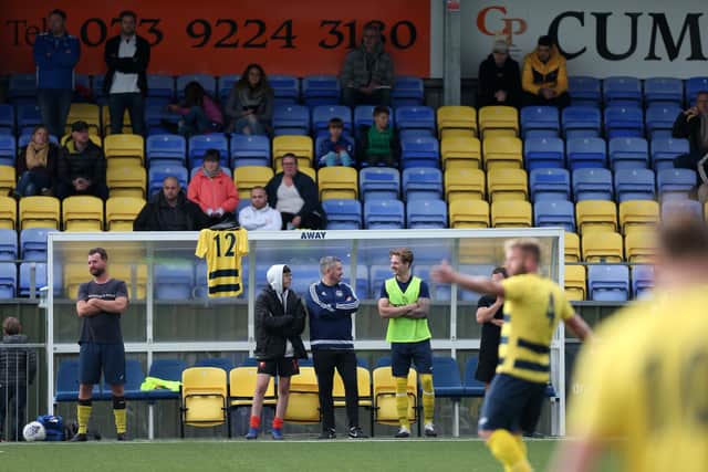 The Paulsgrove bench, including the shirt of squad member Josh Miroy, who collapsed while playing Sunday League football last month. Picture: Chris Moorhouse