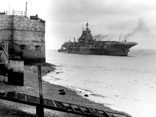 HMS Indomitable goes past the Round Tower in 1953. The News PP690