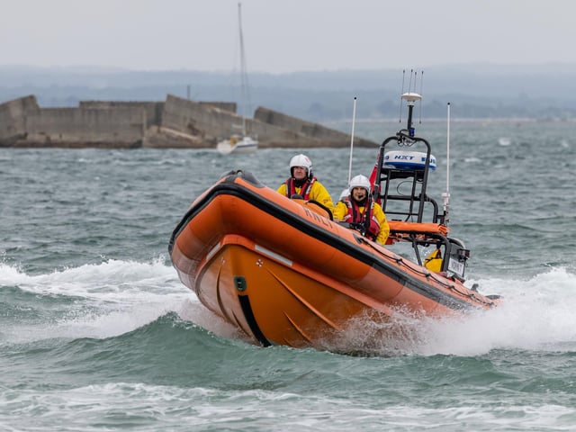 RNLI crews demonstrate their craft's manoeuvrability during the open day at Langstone Harbour. Picture: Mike Cooter (310824)