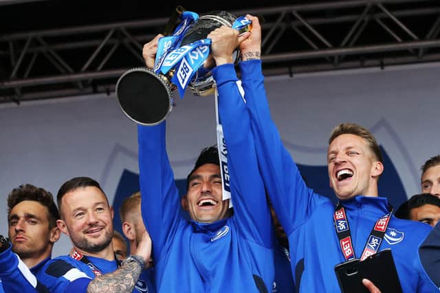 Gary Roberts lifts the League Two title in 2017. Picture: Joe Pepler