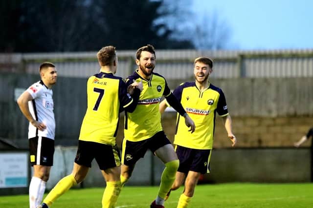 Striker Dan Wooden, centre, celebrates after grabbing one of his three goals in Gosport's thumping Salisbury win. Picture: Tom Phillips