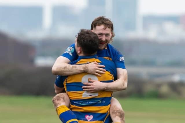 Birthday boy Ben Smith jumps on player-coach Tim Snowden after grabbing one of his two tries. Picture: Martin Burnett