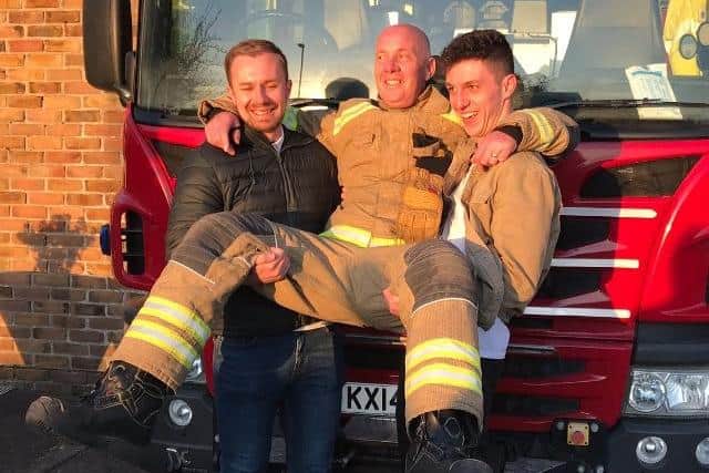 Alan with his sons Jamie and Stehen on the day he retired.