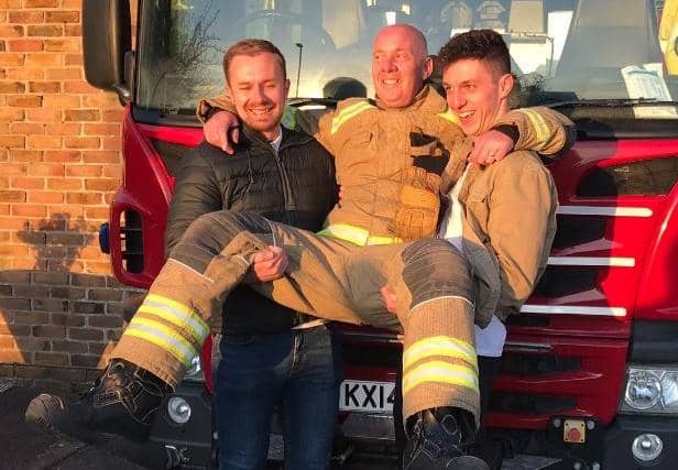 Alan with his sons Jamie and Stehen on the day he retired.