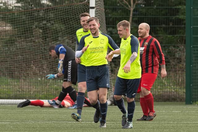 Harvest Home players celebrate their first goal - an own goal - in the 6-0 win over Horndean. Picture: Keith Woodland