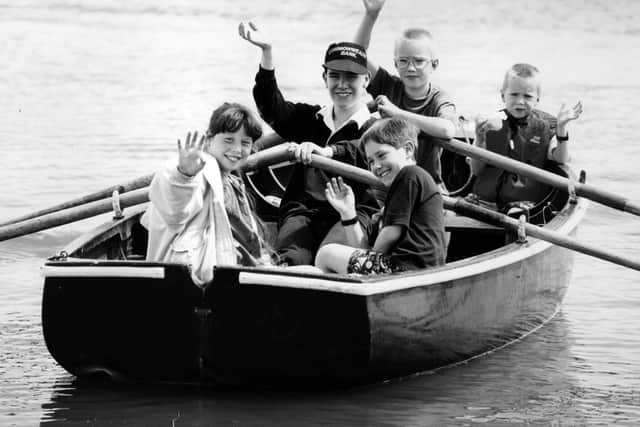 Sea Scout Jonathan Coupe takes the strain on the oars as he gives a guided trip around Fareham Creek in July 1993. The News PP4065