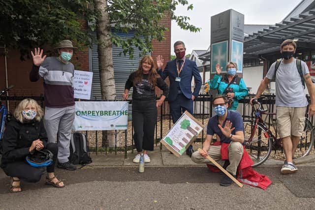 Members of the Let Pompey Breath campaign with councillor George Fielding (fourth from right) on Kingston Crescent before the group left for their walk. Picture: Emily Turner