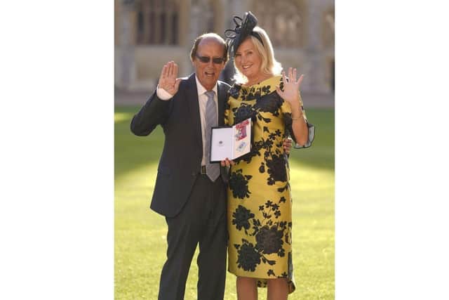 Fred Dinenage stands with his daughter Dame Caroline Dinenage, MP for Gosport, as she holds her Dame Commander of the British Empire medal presented to her by the Princess Royal during an investiture ceremony at Windsor Castle Picture: Andrew Matthews/PA Wire