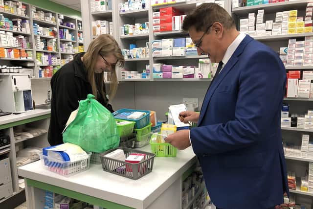 Dispenser Sophie Furmedge with Baldev Laly founder of the Laly's Pharmacy chain.  They are pictured at the Guildhall Walk store.