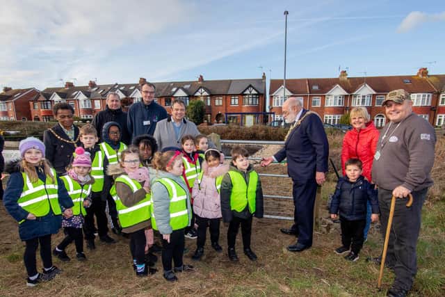 Lord Mayor Hugh Mason, Gary Weaving and pupils of Langstone Junior School marking the opening of the pond.

Picture: Habibur Rahman