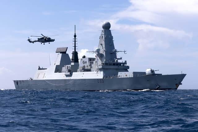 HMS Dauntless and a Wildcat from 815 Naval Air Squadron in the Caribbean Sea. Picture: LPhot Gareth Smith/Royal Navy.