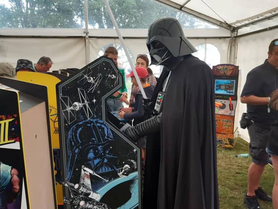 Darth Vader makes an appearance - and plays Star Wars game in the retro gaming tent