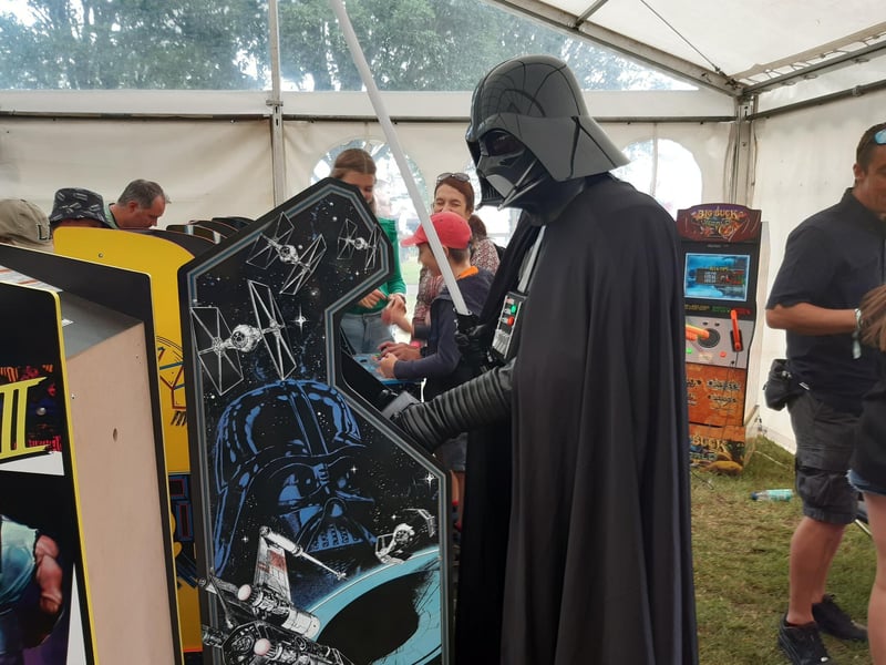 Darth Vader makes an appearance - and plays Star Wars game in the retro gaming tent