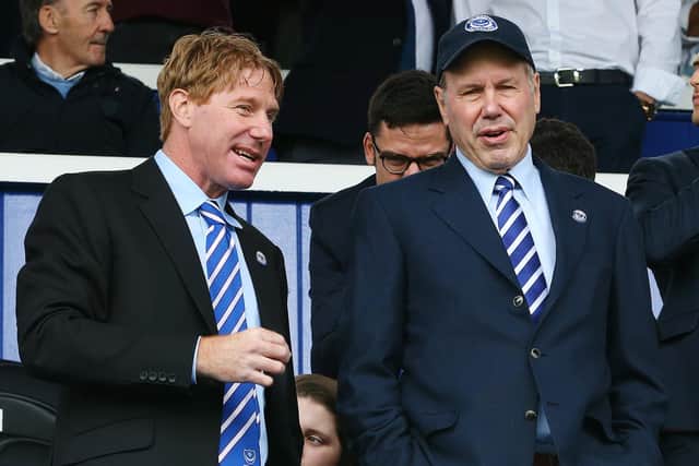 Pompey chairman Michael Eisner, right, with son Eric