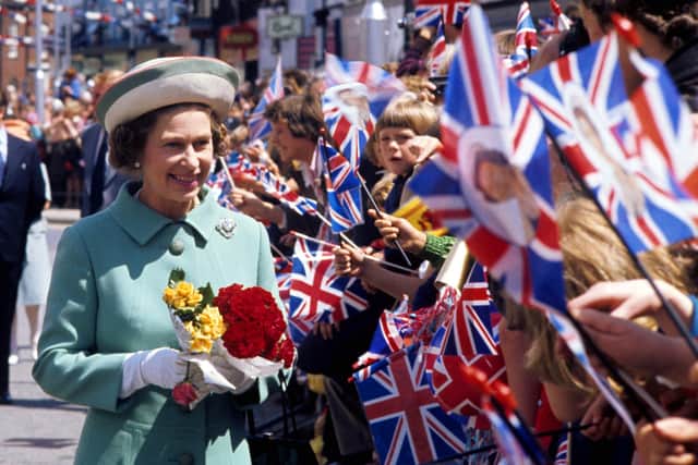 Queen Elizabeth II on a walkabout in Portsmouth in 1977 during her Silver Jubilee tour of Great Britain. Photo credit: Ron Bell/PA Wire