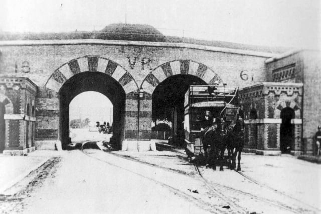 A horse-drawn tram passes through Hilsea Arches about 1900