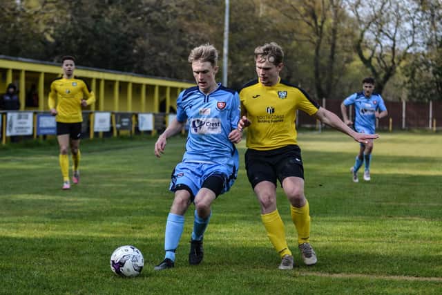 Harvey Aston (blue) in action for AFC Portchester at Hamble Club. Picture: Daniel Haswell.