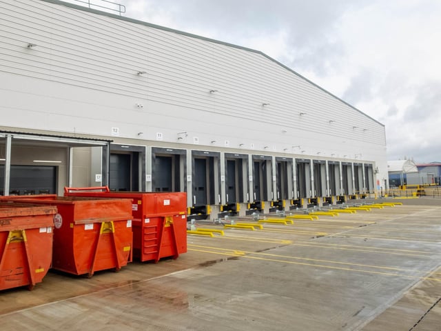 At the back of the warehouse