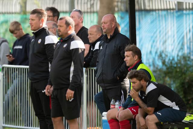 Back in the ground - Horndean boss Michael Birmingham, second left, watches on. Pic: Keith Woodland.