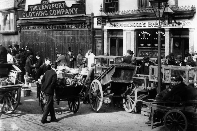 1892:  Street traders in a Southsea street.  (Photo by F J Mortimer/Hulton Archive/Getty Images)
