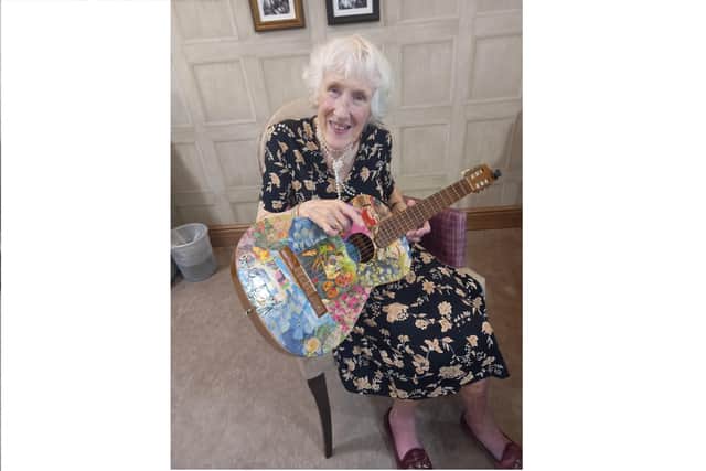 Cathy Barnett with her guitar
Picture: Care UK