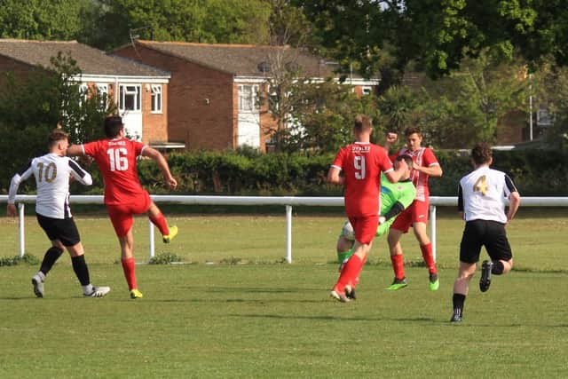 Colden Common keeper Dan Kempson saves late on at Hayling. Picture: Peter Jones