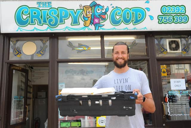 Portsmouth FC player Christian Burgess has been helping at The Crispy Cod in Milton by delivering fish and chips to shielded people in Portsmouth, as part of a volunteer food scheme. Picture: Sarah Standing (190620-137)