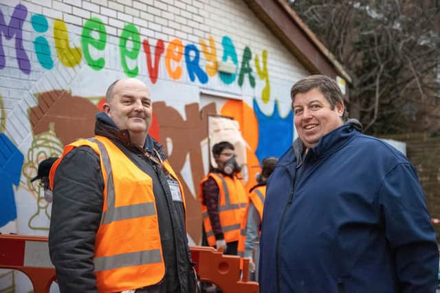 Youngsters from the Portsea area were invited to their local adventure playground on Saturday morning to take part in a new mural on the front of the building.Pictured - John Ryder, CEO of Ecass and John Chapman, Manager of Portsea Adventure PlaygroundPhotos by Alex Shute