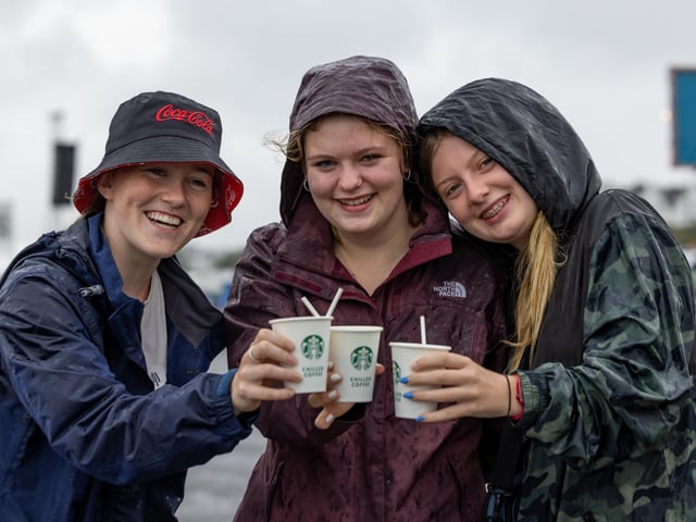 Jennifer Marshall (18), Alice Lacey (17) and Roberta McMillan (17) from Somerset kick-starting the day with some caffeine. Picture: Mike Cooter (240824)