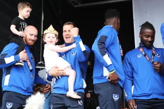 Stanley Aborah (far right) admires his title medal during celebrations on Southsea Common in May 2017. Picture: Joe Pepler