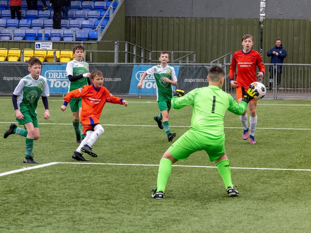 Action from the Under-13 Truman Challenge Cup final between Denmead Youth Lions (orange shirts) and Moneyfields Youth Yellow. Picture: Mike Cooter