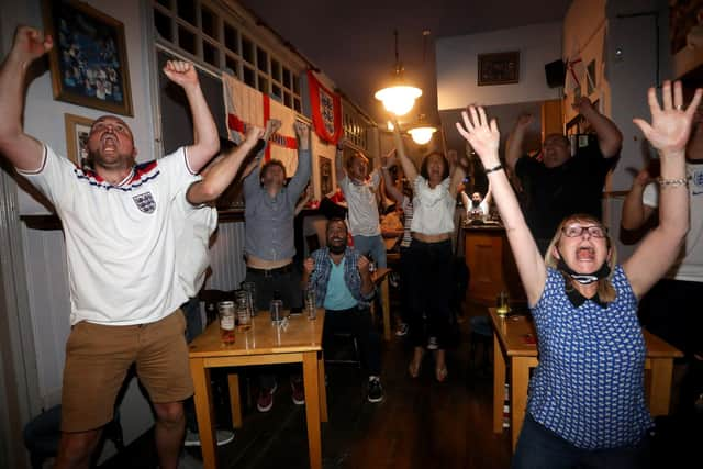 England fans pictured at the Artillery Arms in Portsmouth, UK, watching England play on TV in the Semi-finals at Wembley.

Pictured are fans enjoying the night.

Picture: Sam Stephenson