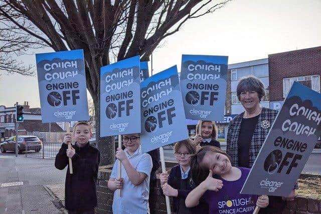 Cllr Lynne Stagg with children from Milton Park primary school promoting the Cough Cough Engine Off campaign
