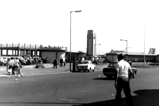 A 1970s view of crowds seated at the station at Seaton Carew. The roller coaster in the fairground can be seen in the distance. Photo: Hartlepool Library Service.