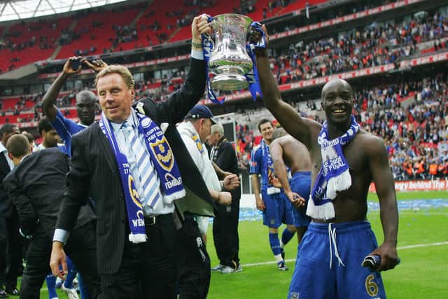 Harry Redknapp and Lassana Diarra celebrate Pompey's FA Cup final win against Cardiff in 2008.   Picture: ADRIAN DENNIS/AFP via Getty Images