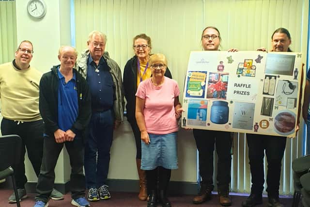 Community Spirit participants presenting the quiz raffle prizes