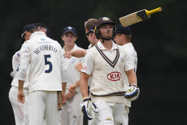 Laurie Evans of Surrey makes his way back to the pavilion after being trapped lbw for 65 by Ian Holland. Photo by Mike Hewitt/Getty Images.