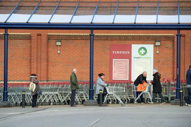 Shoppers queuing. Danny Lawson/PA Wire