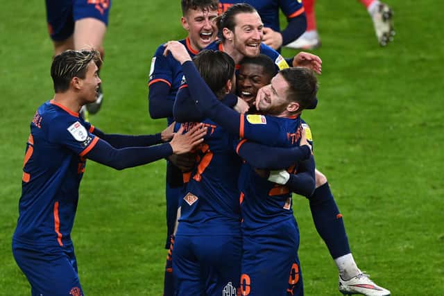 SUNDERLAND, ENGLAND - APRIL 27: Sullay Kaikai of Blackpool celebrates with team mates after scoring their side's first goal during the Sky Bet League One match between Sunderland and Blackpool at Stadium of Light on April 27, 2021 in Sunderland, England. Sporting stadiums around the UK remain under strict restrictions due to the Coronavirus Pandemic as Government social distancing laws prohibit fans inside venues resulting in games being played behind closed doors. (Photo by Stu Forster/Getty Images)