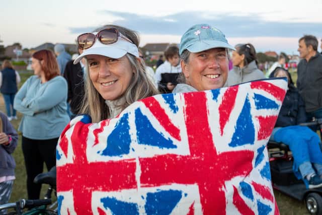 A beacon was lit Thursday evening on Hayling Seafront by the Havant Lord Mayor Cllr Diana Patrick to mark the Queens Jubilee, as hundreds of locals gathered to watch the event.
Pictured - Gillian Weeks and Sarah Botting waited for the lighting of the beacon.
Photos by Alex Shute