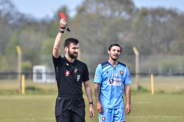 Debutant Connor Hoare watches on as the referee shows a Hamble Club player a red card. Picture: Daniel Haswell.