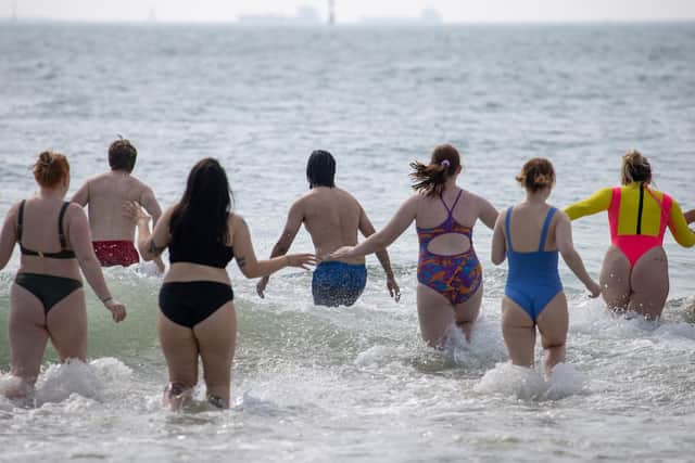 Students from University of Portsmouth braved the cold Solent water to raise money for charity Just One Ocean on Saturday morning near Southsea Pier. Picture: Alex Shute