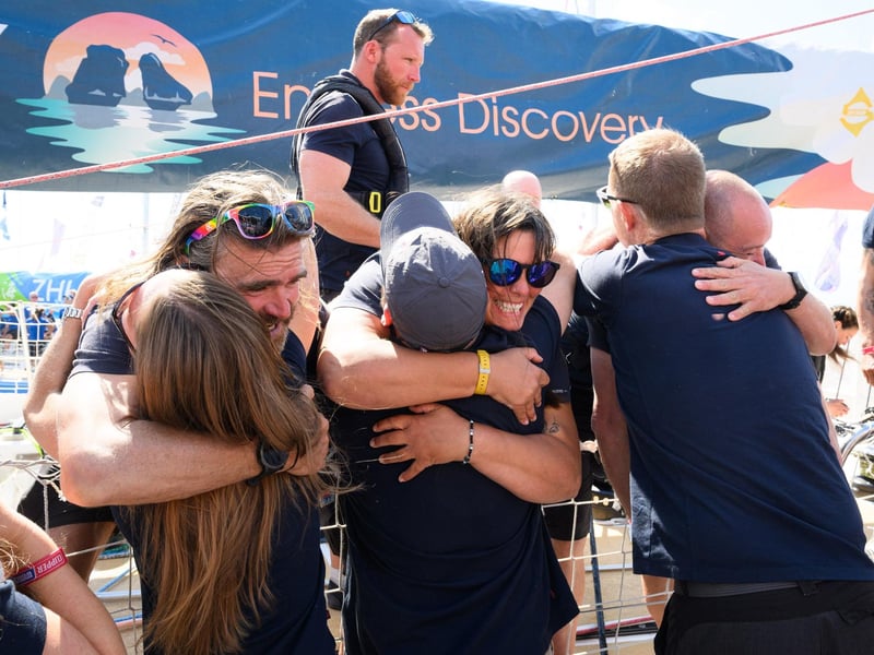 Crew members have a long awaited hug with family and friends.Picture: Keith Woodland (270721-87)